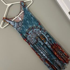 Sleeveless patterned sundress. Pockets. Never worn. Size XS